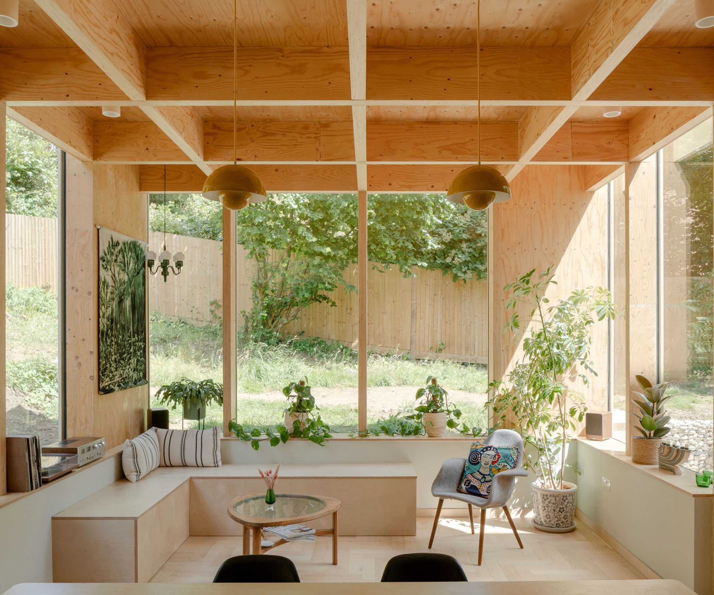 Contemporary light-filled extension with exposed timber and build in seating