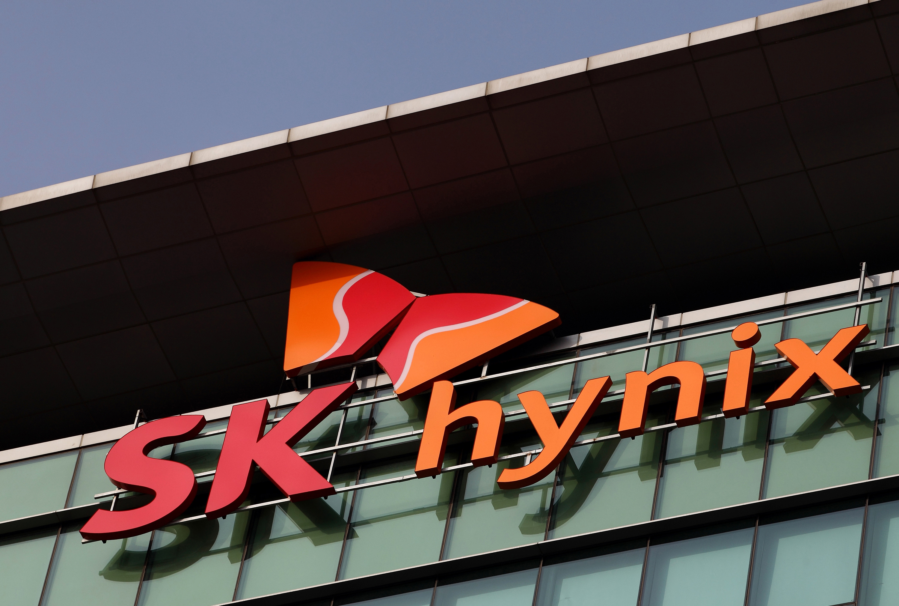 The SK Hynix Semiconductor Inc. logo is displayed at the company&#039;s plant during a media tour organized by Korea Industrial Complex Corp. (KICOX) in Cheongju, South Korea, on Friday, Nov. 23, 2012. KICOX, which develops and manages industrial complexes and support for resident enterprises as a public company under South Korea&#039;s Ministry of Knowledge Economy, held a media tour to the plant