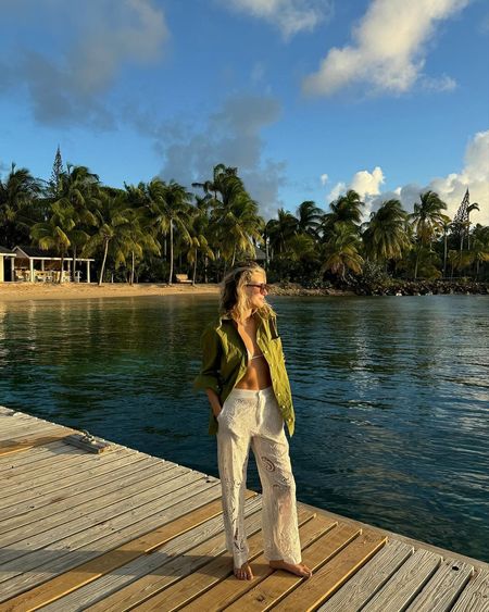 @lucywilliams02 wearing an open shirt and crochet trousers over a bikini