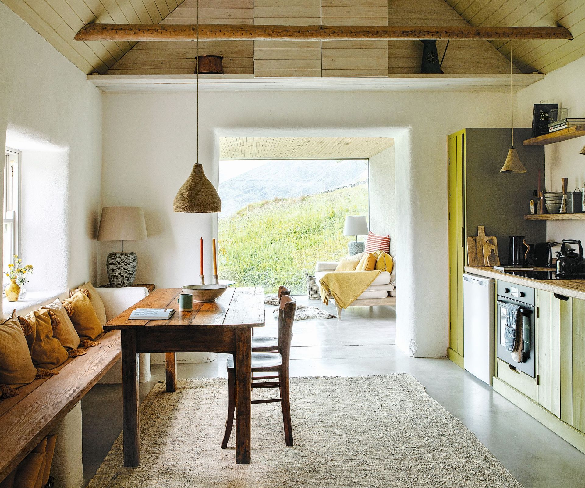 Wooden dining bench, green cupboards