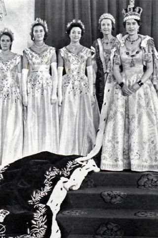 Queen Elizabeth II with her Mistress of the Robes and the six Maids of Honour after her coronation.