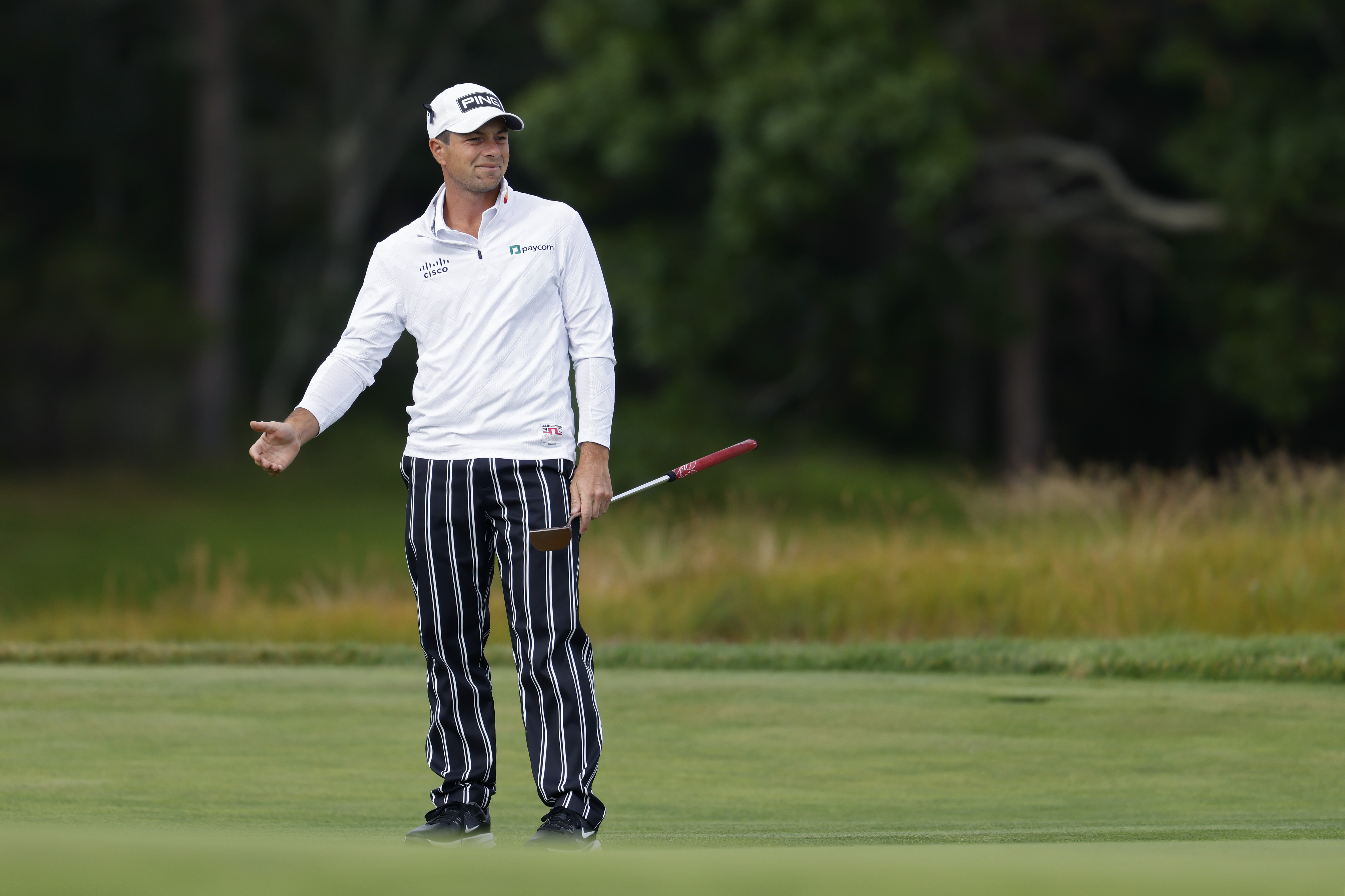 Viktor Hovland watches a putt at the US Open