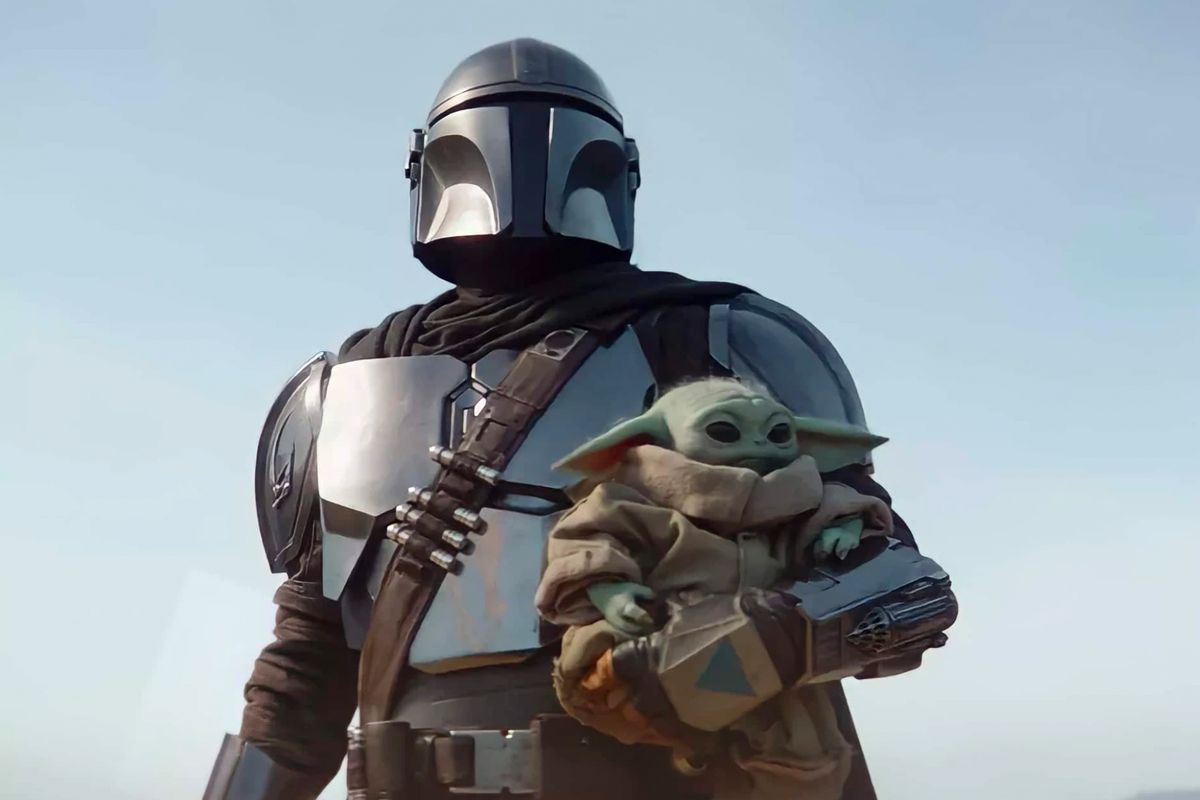 The Mandalorian and Grogu, the Child, standing together.