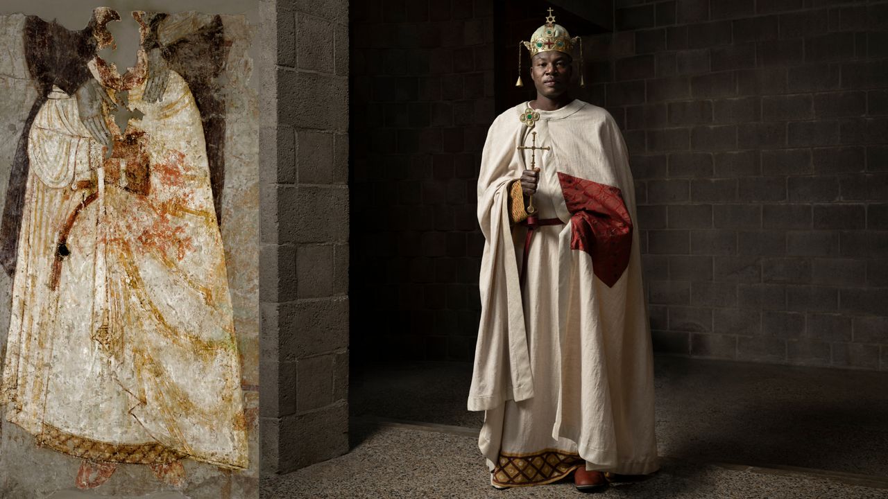 A model wears colorful patterned clothing with an ancient painting cutout next to the model for comparison