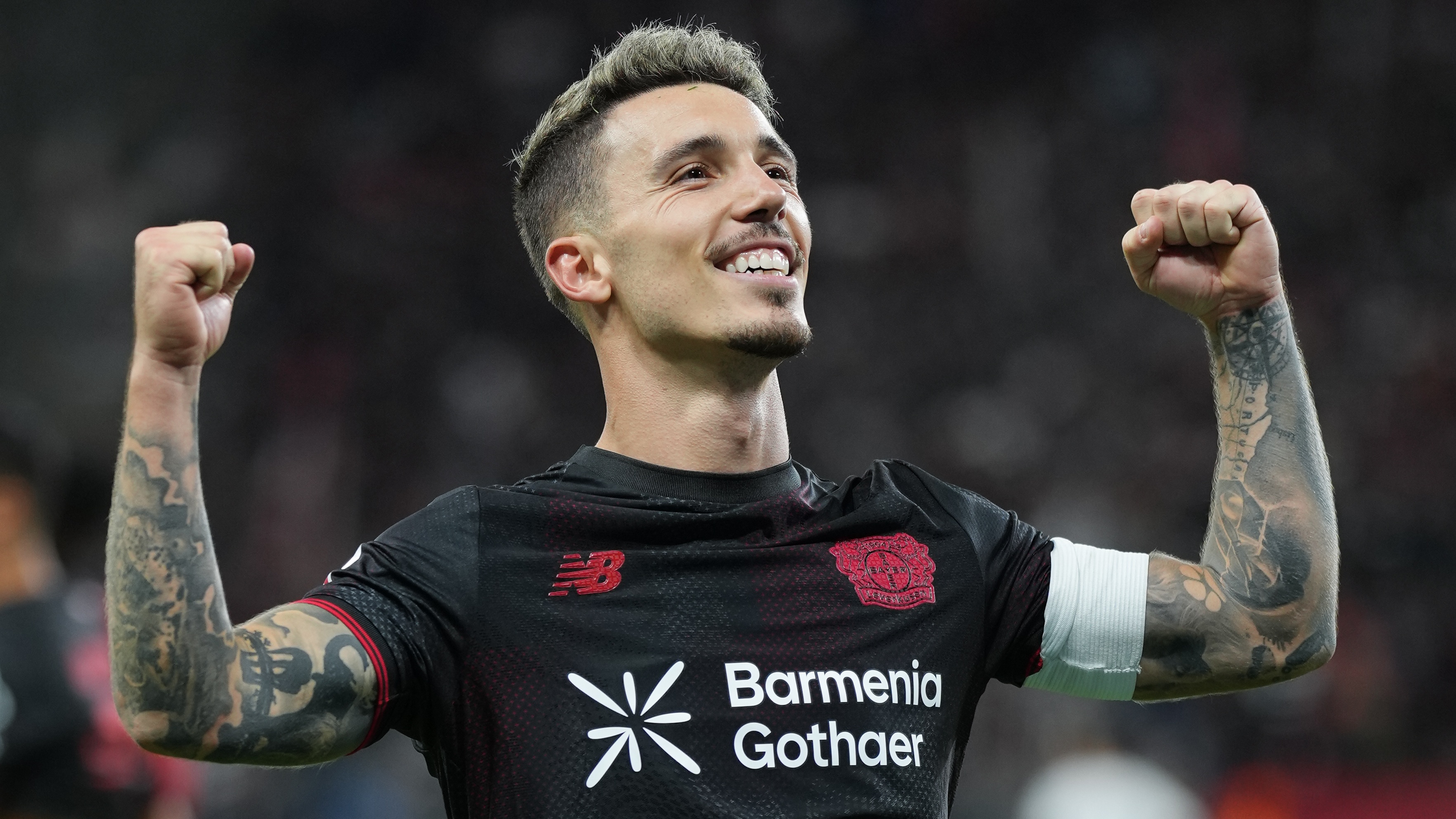 Alejandro Grimaldo of Bayer 04 Leverkusen celebrates after scoring his team&#039;s third goal during the Bundesliga match between Bayer 04 Leverkusen and Eintracht Frankfurt at BayArena on September 12, 2025 in Leverkusen, Germany.