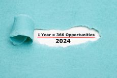 1 Leap Year 2024 equal to 366 opportunities seen through a hole in ripped blue paper.