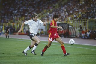 England's Chris Waddle challenges Belgium's Enzo Scifo at the 1990 World Cup.
