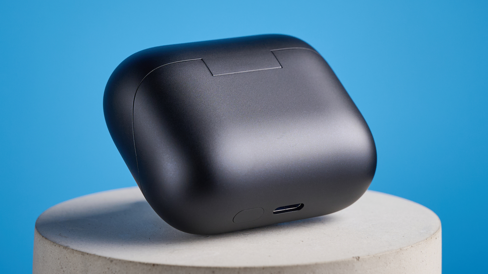 the earfun air pro 4+ earbuds in black showing the ear tips, charging case, and being worn