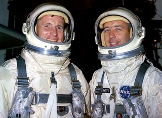 Gemini IV astronauts Ed White (left) and Jim McDivitt stand at Cape Kennedy's Launch Pad 19 on June 1, 1965.