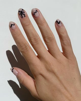 Minimalistic bow manicure by Holly Falcone