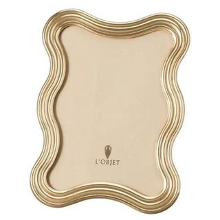 A vintage gold curvy picture frame from 1stDibs