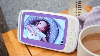 best baby camera monitors in the UK: monitor on side table with image of baby on display