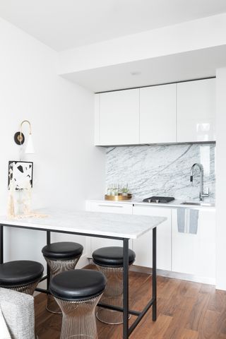 a small modern kitchen with a table