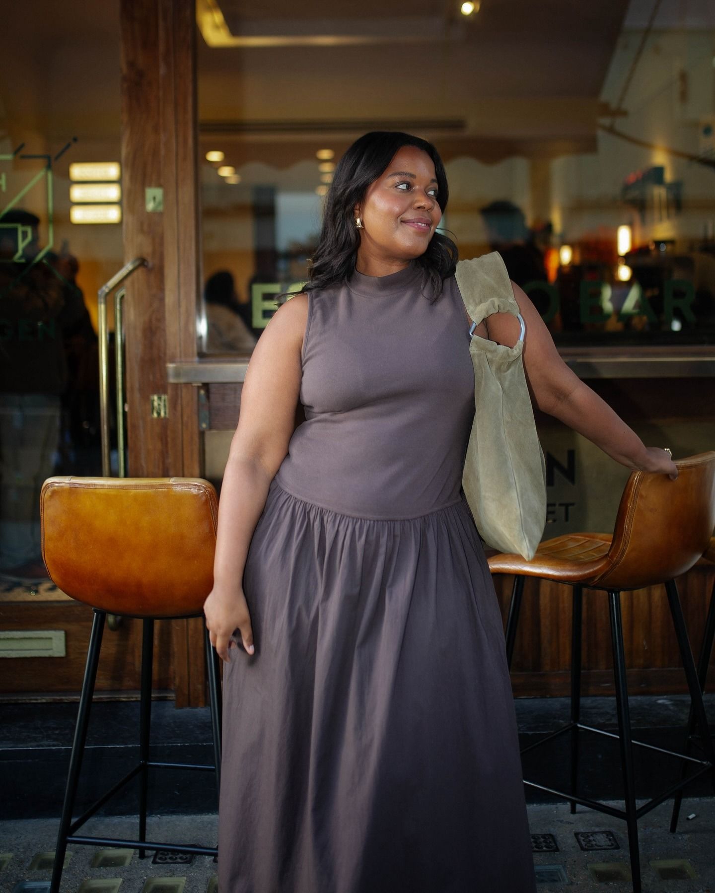 Woman wears brown summer dress