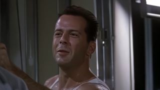 Bruce Willis smirking in Die Hard