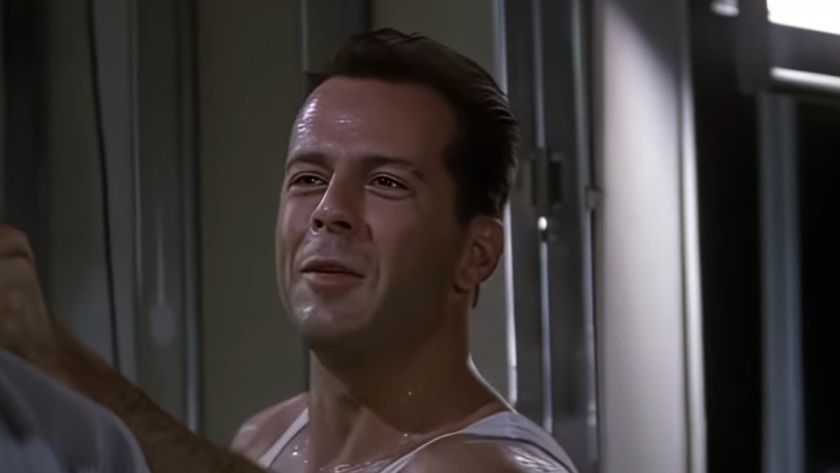 Bruce Willis smirking in Die Hard