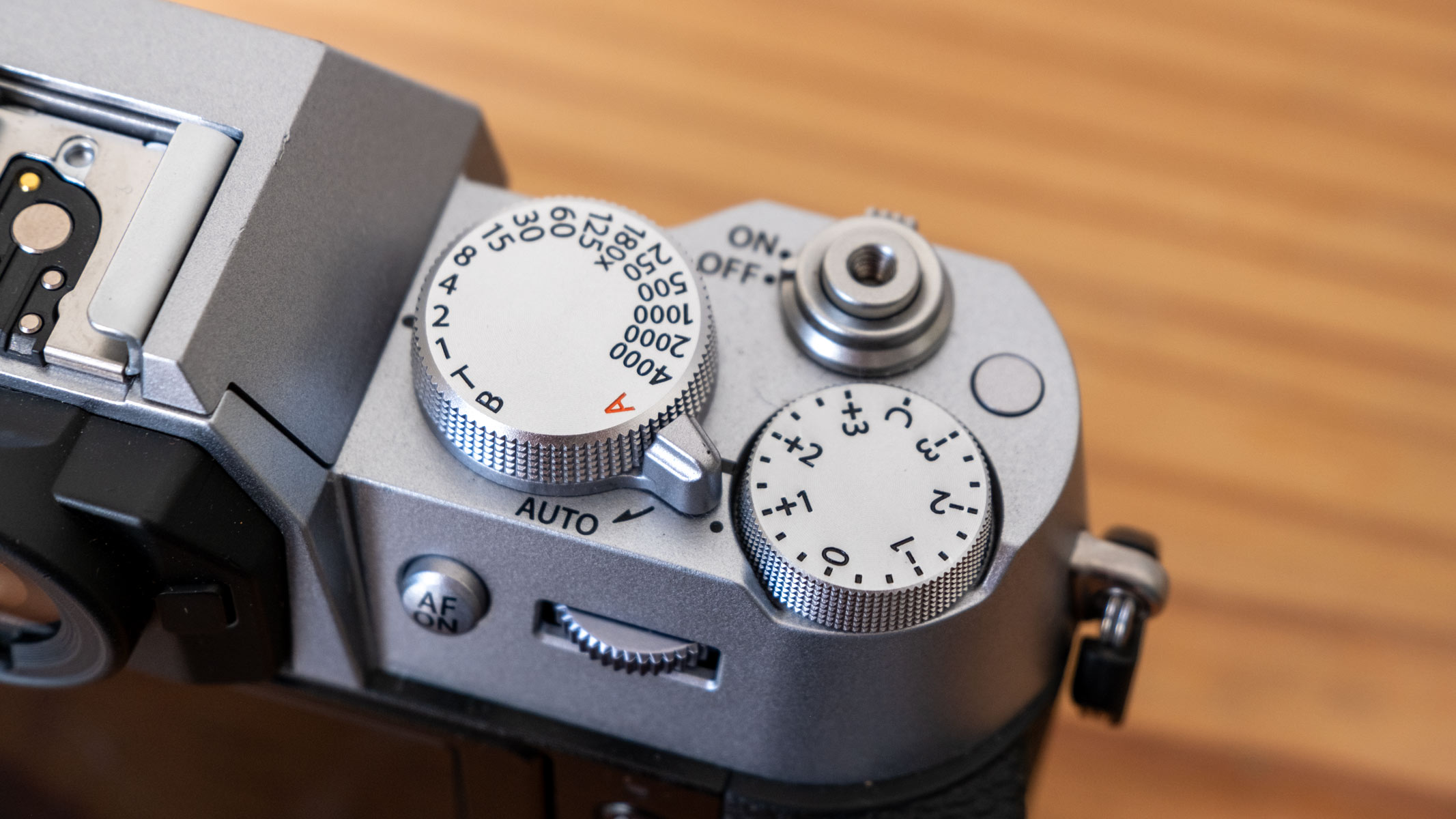 A close-up of the Fujifilm X-T50 dials and power switch