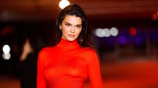 Kendall Jenner's living room has set tongues wagging. Here she is, a white woman with long dark hair, wearing a red dress on the red carpet