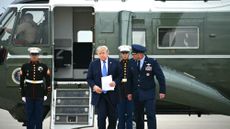 President Donald Trump steps off Marine One as he walks to board Air Force One at Joint Base Andrews, Maryland