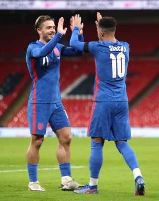 England's Jack Grealish (left) celebrates with Jadon Sancho after setting him up for their side's second goal