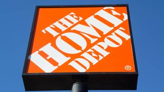 Home Depot sign shown against blue sky