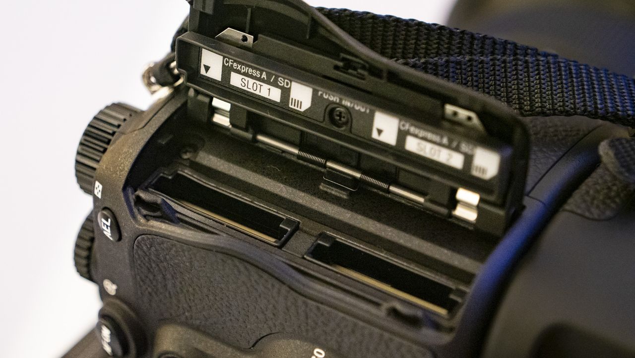Memory card door open of the Sony A9 III showing the twin slots