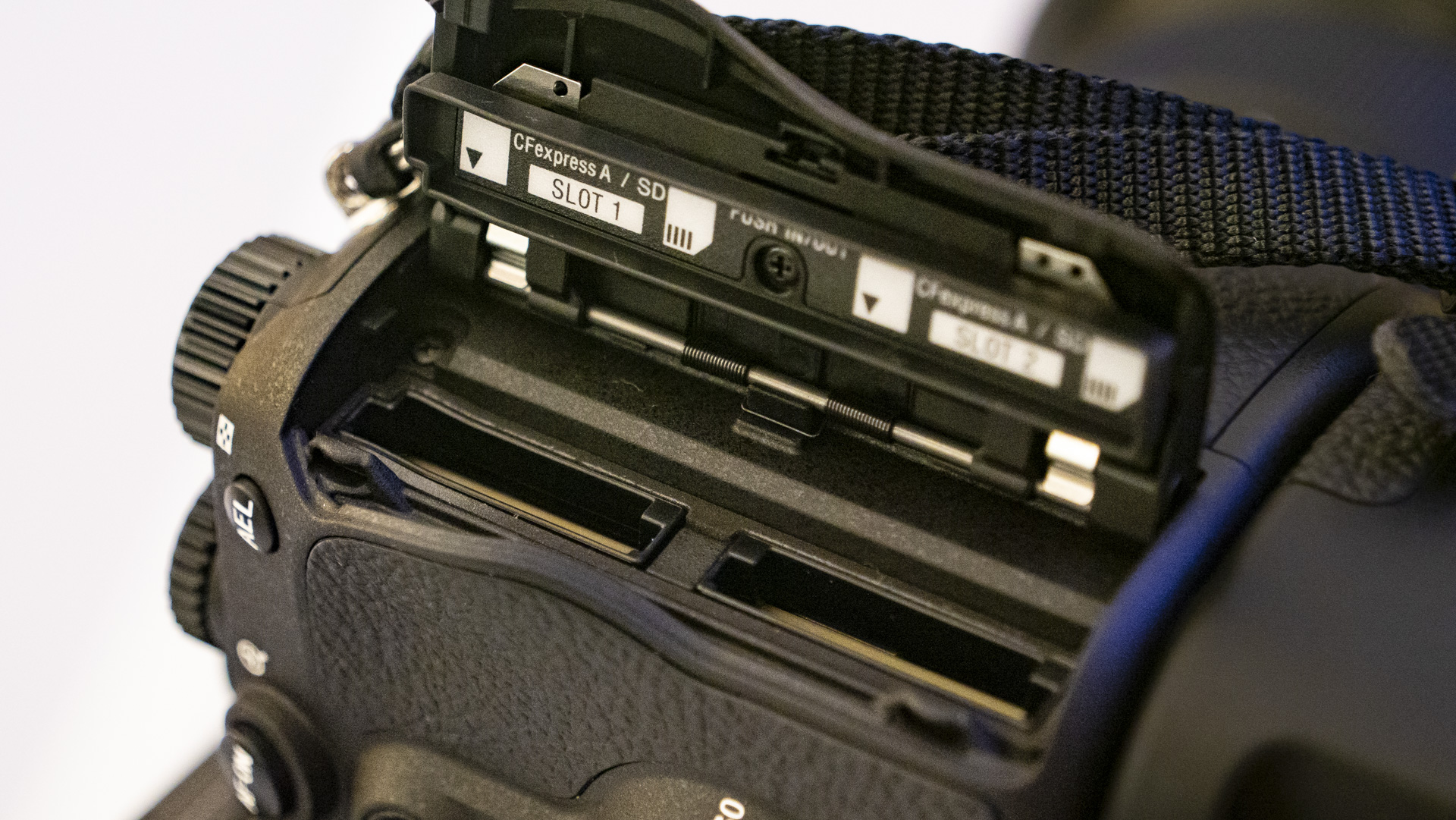 Memory card door open of the Sony A9 III showing the twin slots
