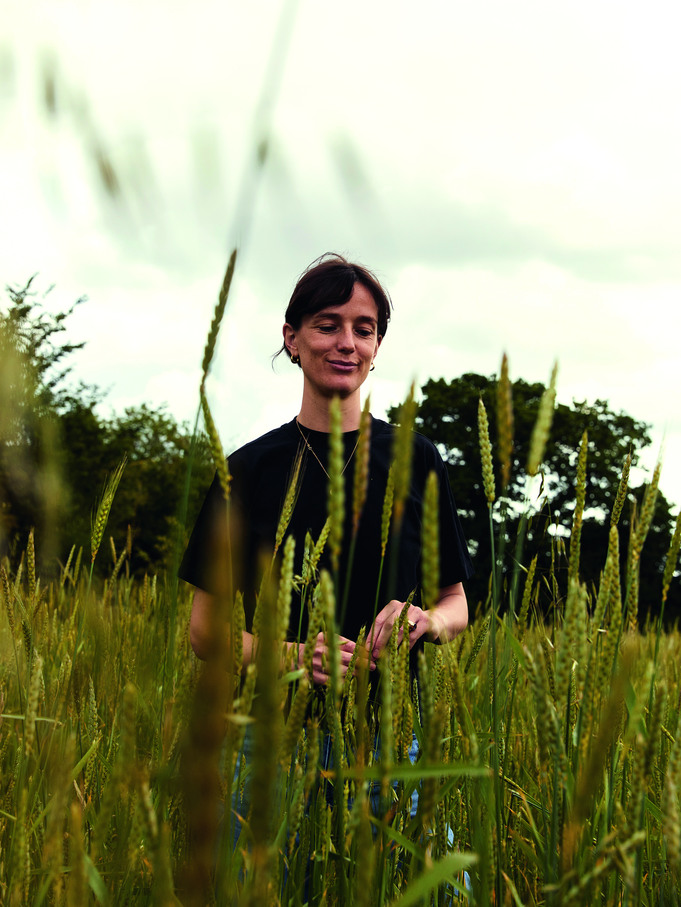 Woman in field of grains