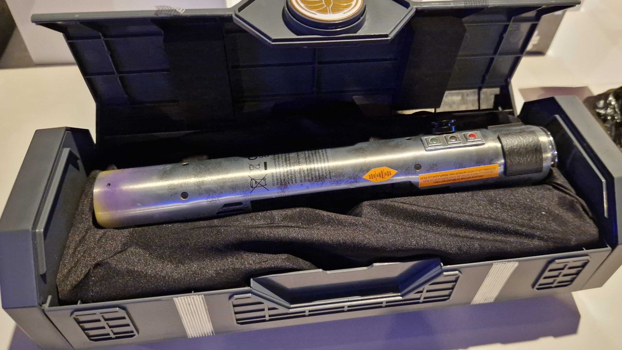 Master Sol lightsaber hilt in a case, twisted to one side