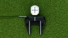 PuttOut Devil Ball from above with a putter behind it