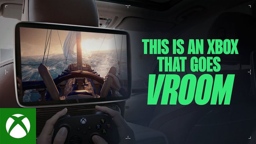 this is an xbox that goes vroom showing someone playing xbox games on a screen in a car