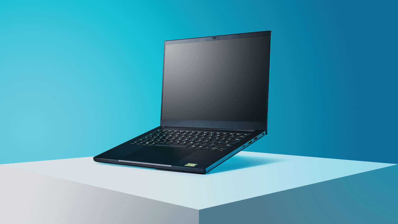 The Razer Blade 14 laptop in black on a blue and white tinted backdrop