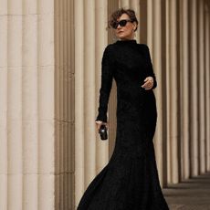 Renia Jaz wearing a black gala dress