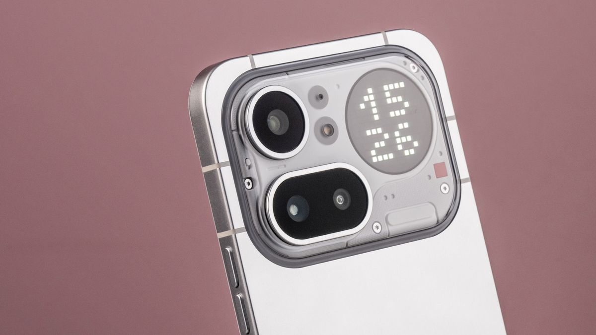 A closeup of the Nothing Phone (4a) Pro's camera module and Glyph Matrix, which features a digital clock reading '15:26'.