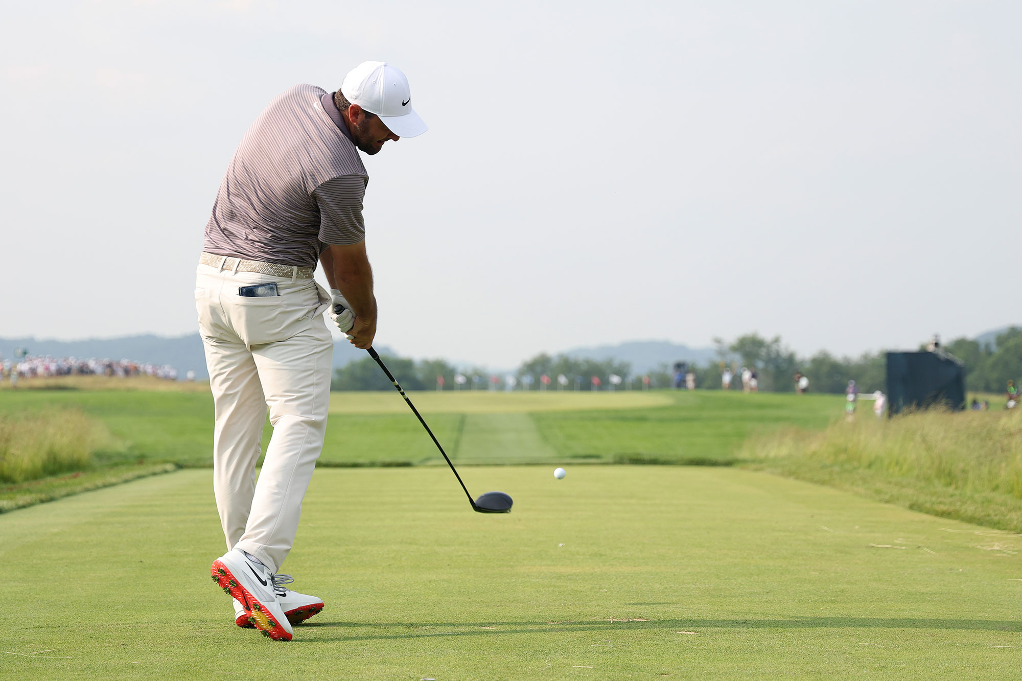 Scottie Scheffler just after impact, hitting a tee shot with driver at Oakmont Country Club during the US Open