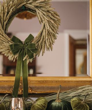 autumn wreath on mantlepiece made of wheat