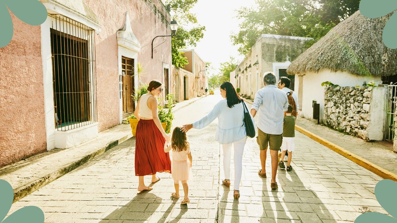 Travel Scams news piece - family walking down the street on holiday 