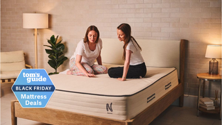 2 women sitting on the Nolah Natural 11 mattress 