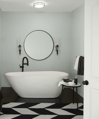 bathroom painted in Behr pale blue with large tub