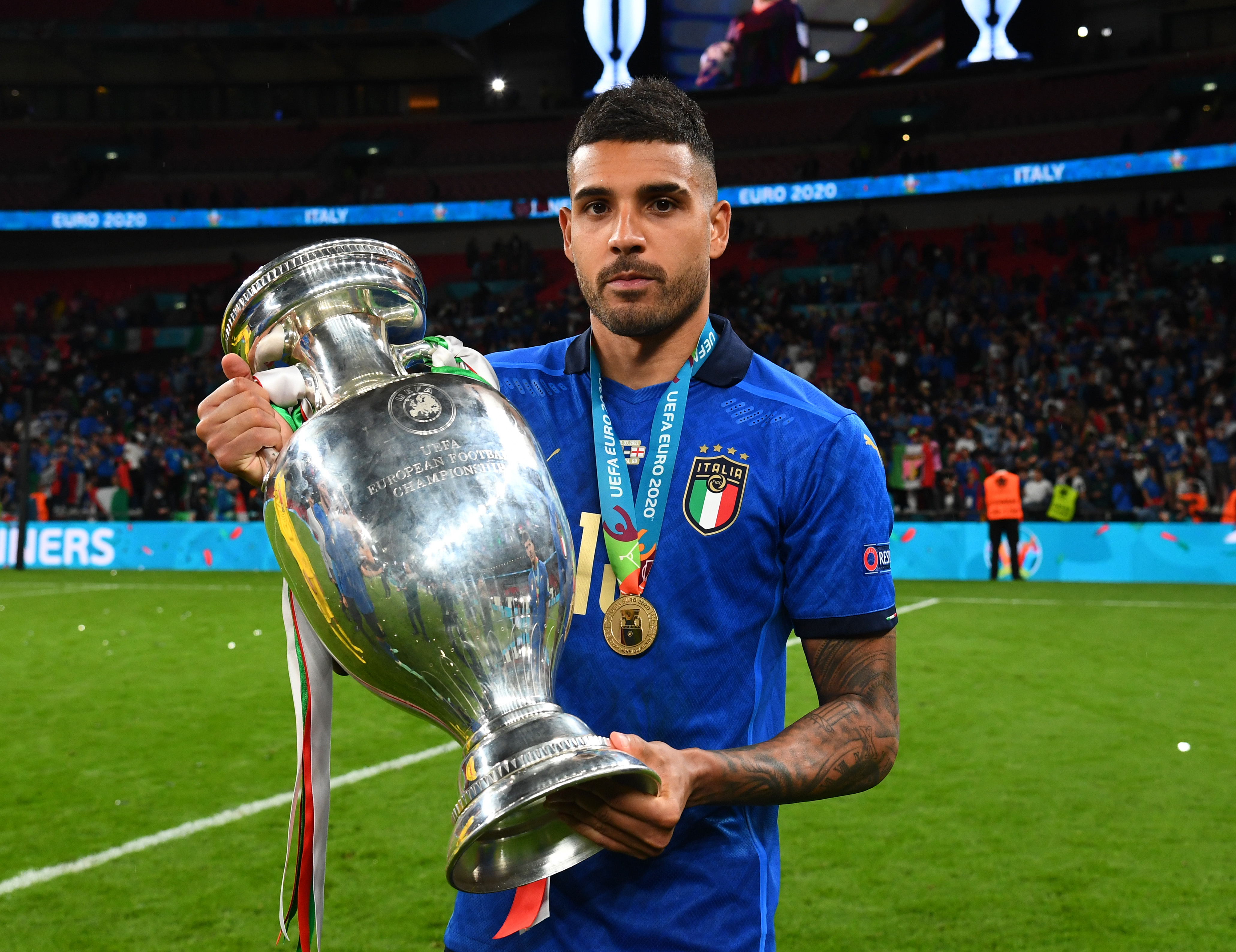 Emerson Palmieri poses with the European Championship trophy after Italy's win over England in the Euro 2020 final.