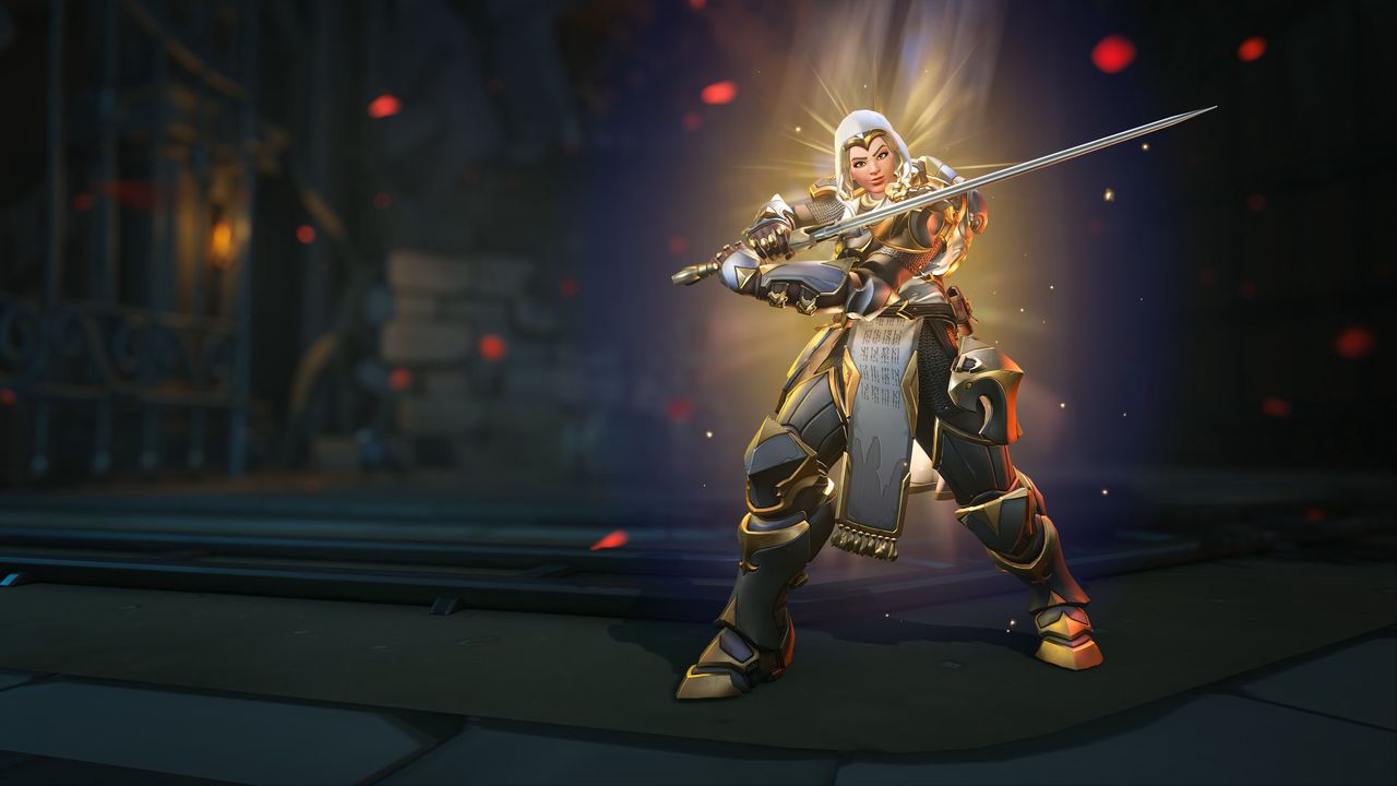 Armored warrior with a sword, bathed in golden light, stands confidently in a dim, stone-walled room with red embers floating around.
