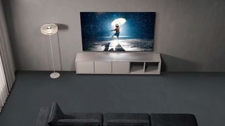 Samsung S95C OLED TV wallmounted above stand unit