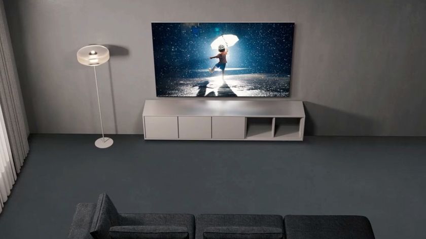 Samsung S95C OLED TV wallmounted above stand unit