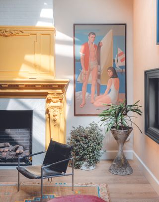 A living room with a painted fireplace