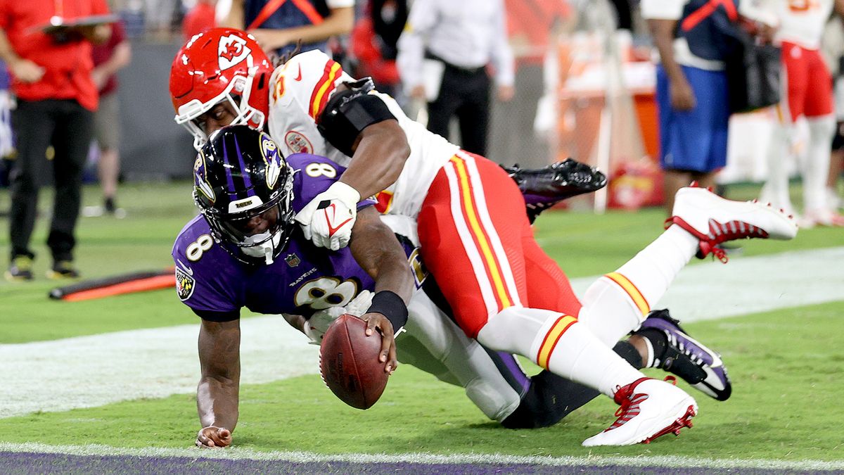 Lamar Jackson #8 of the Baltimore Ravens dives into the end zone for a touchdown past the tackle of Michael Danna #51 of the Kansas City Chiefs during the fourth quarter at M&amp;T Bank Stadium on Sept. 19, 2021 in Baltimore, Maryland.