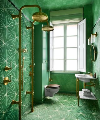 Small bathroom tile ideas showing a green wet room with decorative tiles