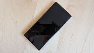 A white-backed Samsung Galaxy S23 Ultra sitting on a desk