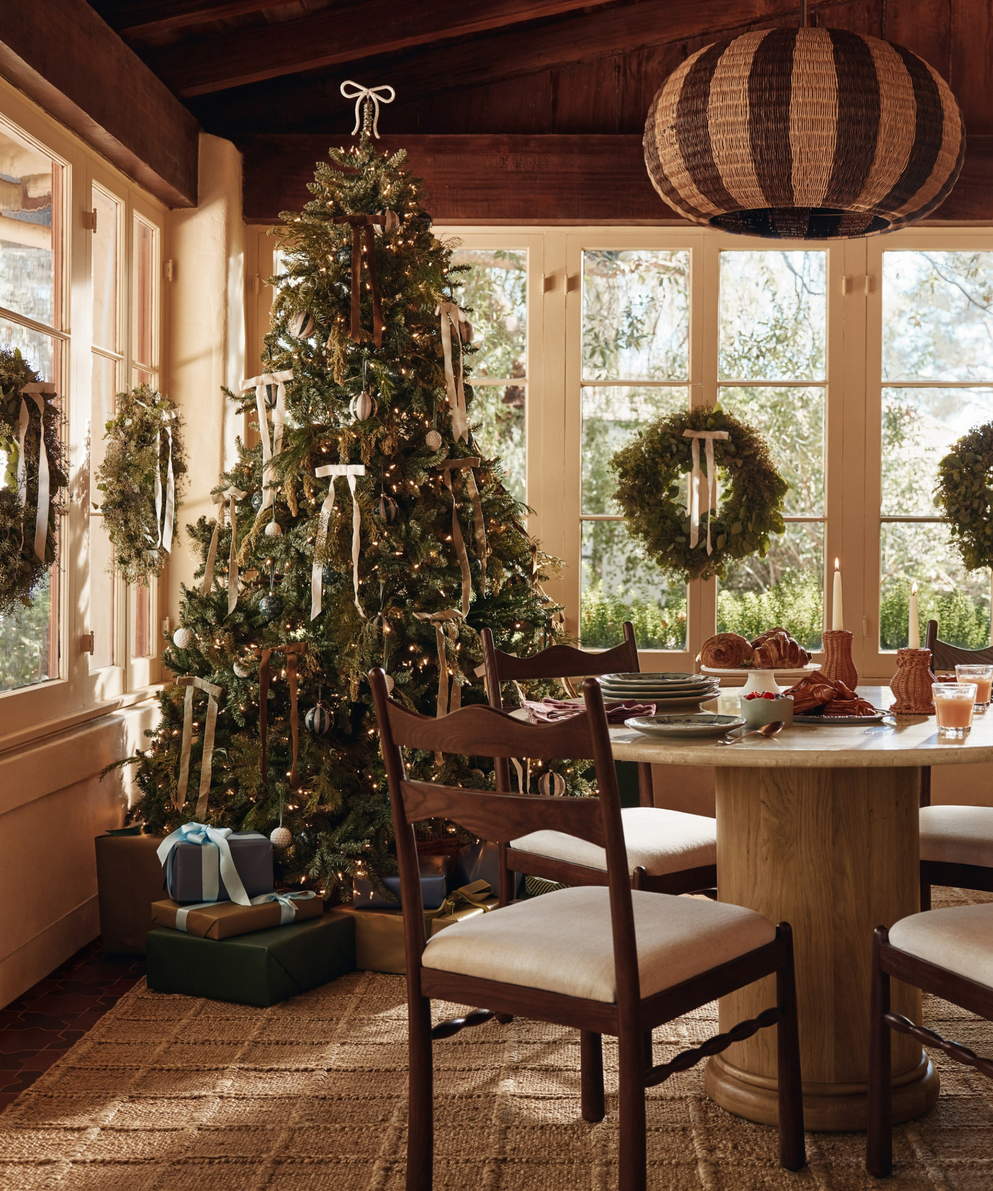 a dining room decorated for Christmas
