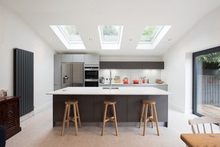a trio of rooflights in a modern kitchen extension