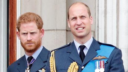 Prince Harry, Duke of Sussex and Prince William, Duke of Cambridge watch a flypast to mark the centenary of the Royal Air Force from the balcony of Buckingham Palace on July 10, 2018 in London, England